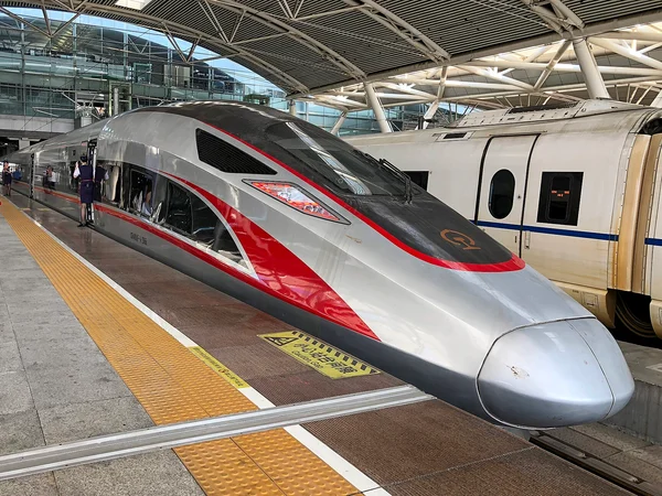 Passengers boarding a high-speed train in China