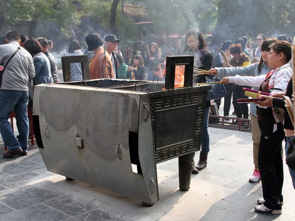 Visitors at a Chinese temple where quiet, respectful behaviour matters