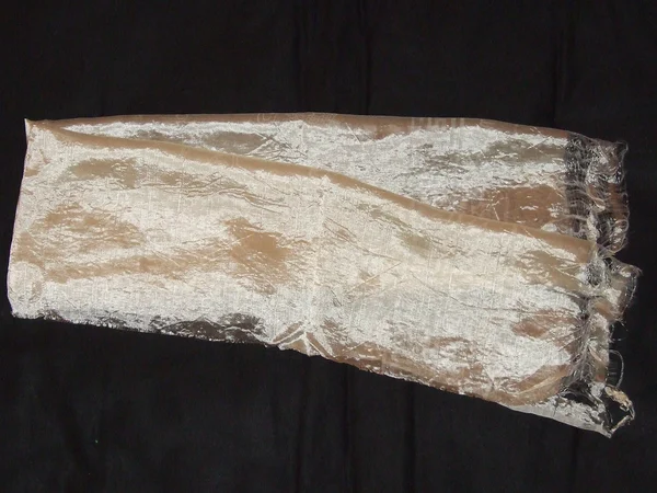 White Tibetan khata ceremonial scarf displayed with woven symbols White Tibetan khata ceremonial scarf displayed with woven symbols
