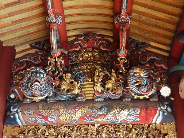 Detailed wood carving on traditional Chinese architecture