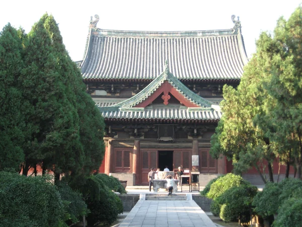 Traditional Chinese timber hall with tiled roof and bracket sets Traditional Chinese timber hall with tiled roof and bracket sets
