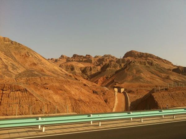 Sunlit Flaming Mountains near Turpan in Xinjiang Sunlit Flaming Mountains near Turpan in Xinjiang