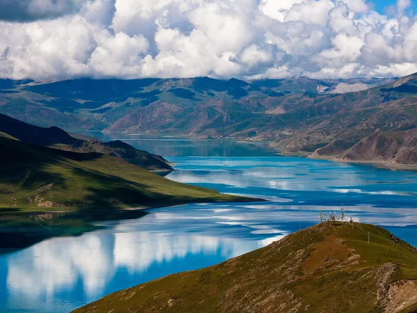 Yamdrok Yumtso extending between high mountains in Tibet