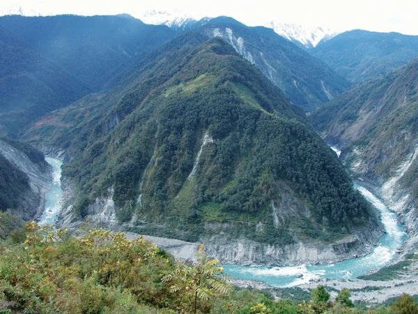 Yarlung Tsangpo Grand Canyon beneath high mountains in Tibet Yarlung Tsangpo Grand Canyon beneath high mountains in Tibet