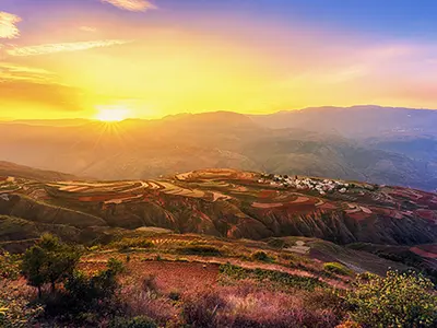 Sunset over the colorful Dongchuan Red Land in Yunnan