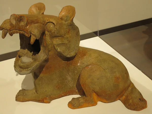 A Han dynasty earthenware dog figure