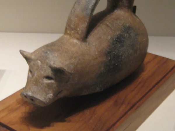 A Neolithic Dawenkou pig-shaped gui vessel A Neolithic Dawenkou pig-shaped gui vessel