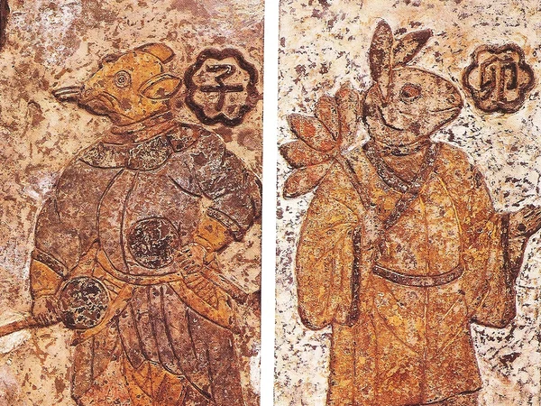 Han dynasty guardians of day and night with a rabbit motif Han dynasty guardians of day and night with a rabbit motif