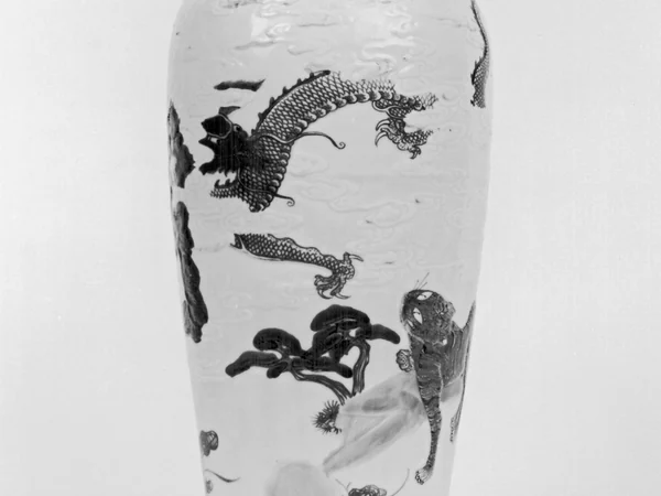 A Chinese vase decorated with tiger and dragon imagery A Chinese vase decorated with tiger and dragon imagery