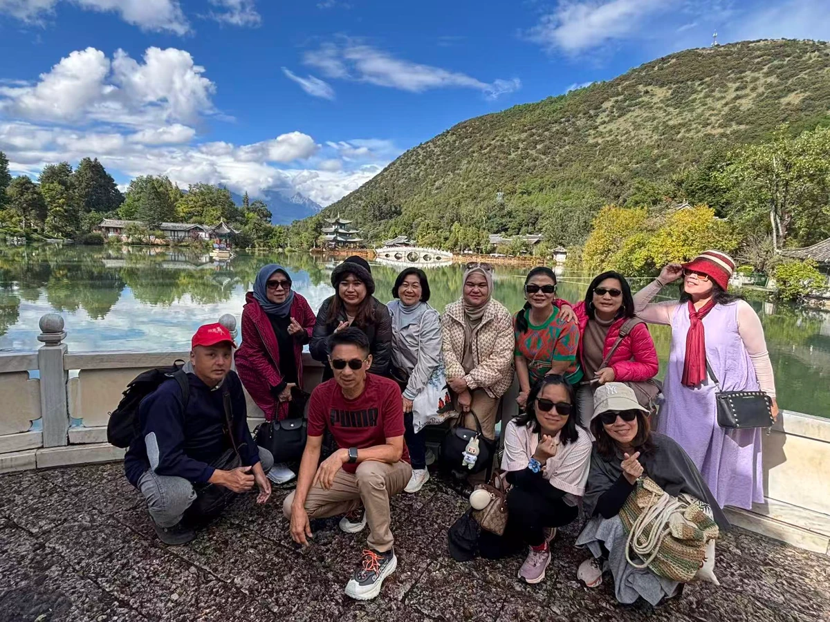 Muslim tour guests by Black Dragon Pool in Lijiang, Yunnan
