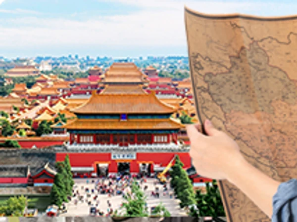 Traveler holding a China map above the Forbidden City
