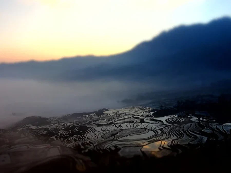 Flooded Yuanyang rice terraces reflecting the sky in Yunnan