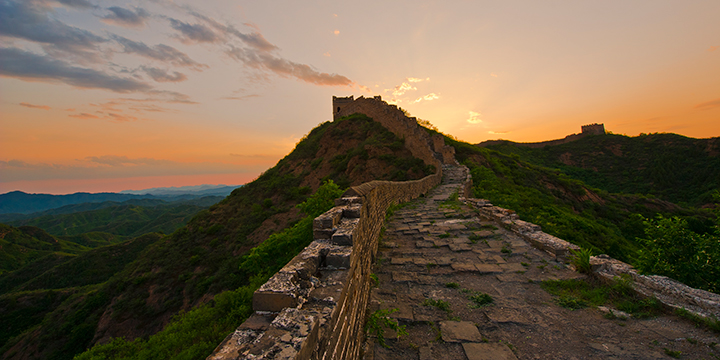 Sunset behind a watchtower on Jinshanling Great Wall Sunset behind a watchtower on Jinshanling Great Wall
