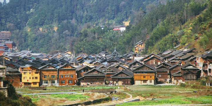 Timber houses, drum towers and mountain setting in Zhaoxing Timber houses, drum towers and mountain setting in Zhaoxing