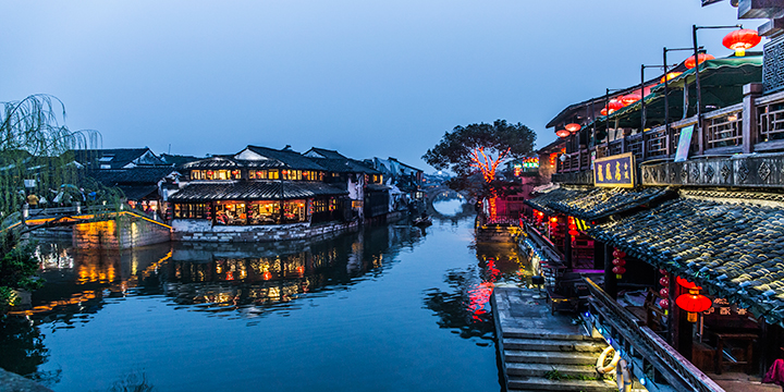 Blue-hour reflections along the inhabited canal in Xitang Blue-hour reflections along the inhabited canal in Xitang