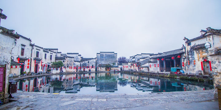 South Lake, arched bridge and traditional houses at Hongcun entrance South Lake, arched bridge and traditional houses at Hongcun entrance