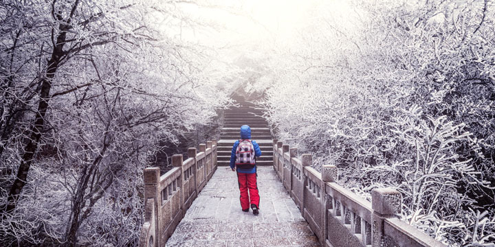 Snow-covered walking path on Mount Huangshan in winter Snow-covered walking path on Mount Huangshan in winter