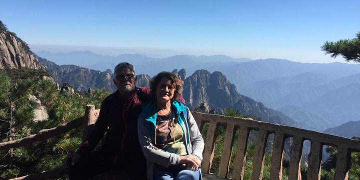 Travelers at a high viewpoint on Mount Huangshan Travelers at a high viewpoint on Mount Huangshan