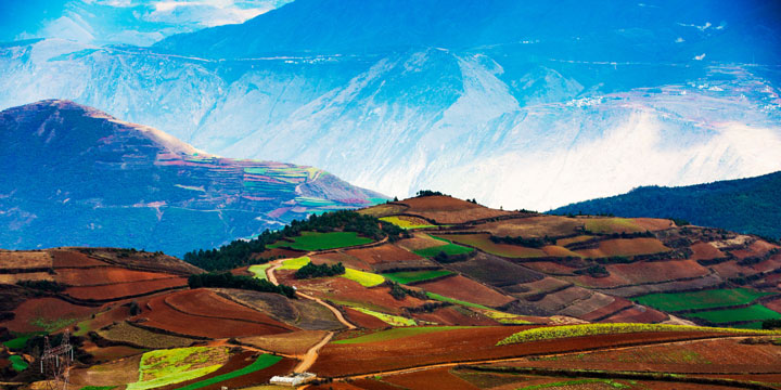 Layered red fields and mountain farming landscape at Dongchuan Layered red fields and mountain farming landscape at Dongchuan