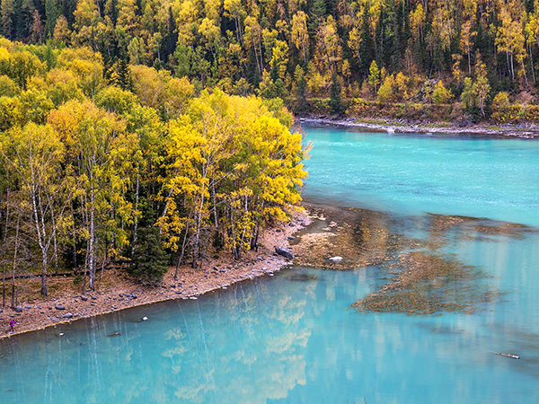 Turquoise Kanas Lake among autumn forest in Xinjiang Turquoise Kanas Lake among autumn forest in Xinjiang
