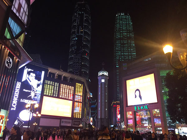Illuminated Jiefangbei pedestrian district and Liberation Monument at night