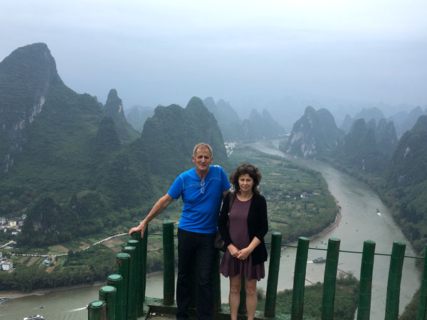 Travelers overlooking the karst landscape near Guilin