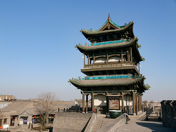 Pingyao Ancient City tower and rooftops in autumn light