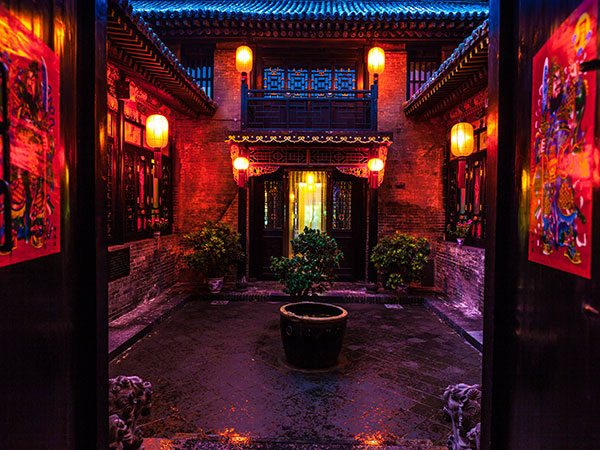 Historic Pingyao courtyard accommodation illuminated at night Historic Pingyao courtyard accommodation illuminated at night
