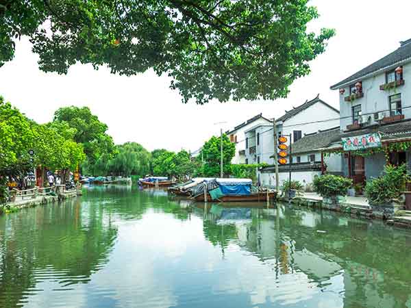 Canal, whitewashed houses and stone bridge in Zhouzhuang Ancient Town Canal, whitewashed houses and stone bridge in Zhouzhuang Ancient Town
