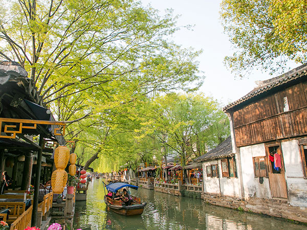 Leafy waterside lane and traditional buildings in Zhouzhuang Leafy waterside lane and traditional buildings in Zhouzhuang