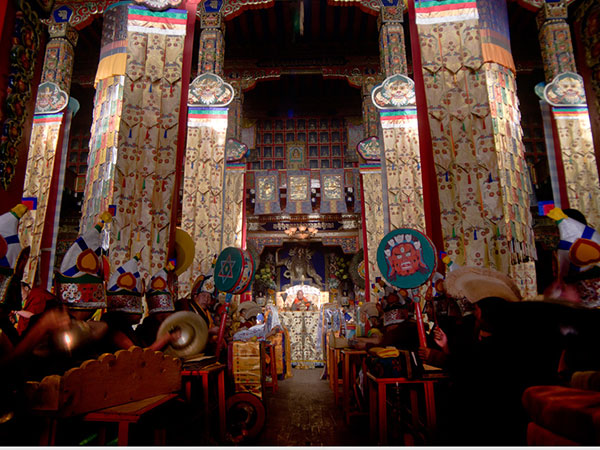 Interior of a Tibetan Bon religious hall with painted decoration and ritual instruments